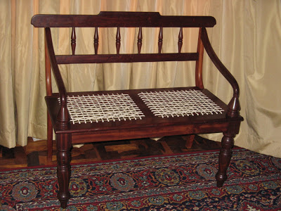 Old-fashioned double “riempie” seat . This is a precise replica of the original chair from days of yore. This specimen was made of railway sleepers
