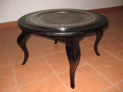 Round coffee table with metal tray sunk into the top  