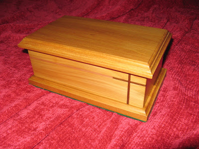 Jewel box made of yellow wood with embuia cross. The lid is loose and not fixed with hinges