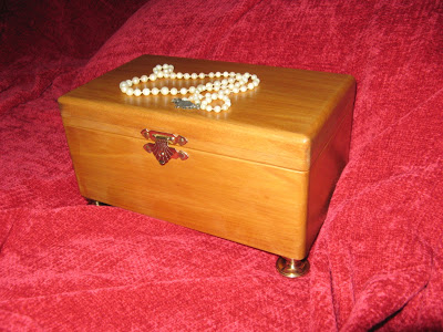 Yellow wood jewel box with brass legs, hinges and clasp